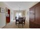 Inviting dining room with seating for six, adjacent to a modern kitchen at 921 Forest Park Ln, Suwanee, GA 30024