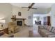 Spacious living area flowing into dining space, with a cozy fireplace feature at 921 Forest Park Ln, Suwanee, GA 30024