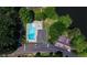 Aerial view of a neighborhood pool, parking area and a lake in the background at 100 Silverbell Ct, Roswell, GA 30075