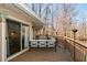 Inviting outdoor seating area on the deck, perfect for relaxing and enjoying the peaceful wooded setting at 100 Silverbell Ct, Roswell, GA 30075