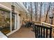 Expansive back deck featuring a dining set and rocking chairs, ideal for entertaining and outdoor dining at 100 Silverbell Ct, Roswell, GA 30075