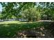 Lush backyard featuring a horseshoe pit and spacious lawn, ideal for outdoor activities and relaxation at 100 Silverbell Ct, Roswell, GA 30075