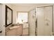 Well-lit bathroom with a glass shower, mosaic countertop, and modern sink basin at 100 Silverbell Ct, Roswell, GA 30075