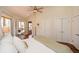 Bedroom with a ceiling fan, and large closets at 100 Silverbell Ct, Roswell, GA 30075