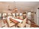 Bright dining area features a wood table, vaulted ceilings, and plenty of natural light from the surrounding windows at 100 Silverbell Ct, Roswell, GA 30075