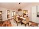 Elegant dining room with a wood table, stylish chairs, and modern lighting at 100 Silverbell Ct, Roswell, GA 30075