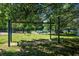 Outdoor exercise equipment with a green trim offers a space for fitness amid the greenery at 100 Silverbell Ct, Roswell, GA 30075