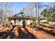 Unique home with an interesting architectural design and landscaping nestled among the trees at 100 Silverbell Ct, Roswell, GA 30075