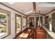 Hallway with skylights, hardwood floors, leading to outdoor patio at 100 Silverbell Ct, Roswell, GA 30075