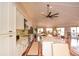 Well-lit kitchen featuring stainless steel appliances and an island with bar seating at 100 Silverbell Ct, Roswell, GA 30075