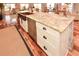 Kitchen island with white cabinetry, stainless steel appliances, and eat-in bar at 100 Silverbell Ct, Roswell, GA 30075