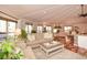 Open-concept living room featuring a vaulted ceiling, hardwood floors, and a cozy seating area at 100 Silverbell Ct, Roswell, GA 30075