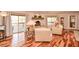 Living room with fireplace, hardwood floors, comfortable seating, and natural light at 100 Silverbell Ct, Roswell, GA 30075