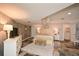 Spacious main bedroom with accent wall, ceiling fan and tiled floor at 100 Silverbell Ct, Roswell, GA 30075