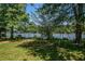 Swing set overlooking the lake, offering a fun outdoor play area with scenic views at 100 Silverbell Ct, Roswell, GA 30075