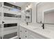 Modern bathroom featuring double sinks, white cabinets, black hardware and a glass-enclosed shower at 2333 Mason Dr # D26, Atlanta, GA 30316