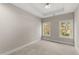 Bedroom with carpet, two windows and a tray ceiling at 2333 Mason Dr # D26, Atlanta, GA 30316