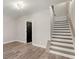 Bonus room with stairs and doorway leading to a modern staircase and black door at 2333 Mason Dr # D26, Atlanta, GA 30316