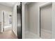 Hallway with dark sliding door, light walls, and dark door frames at 2333 Mason Dr # D26, Atlanta, GA 30316