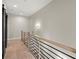 Hallway with modern black and wood railing at 2333 Mason Dr # D26, Atlanta, GA 30316