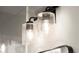 Stylish vanity lighting with clear glass shades and black hardware at 2333 Mason Dr # D26, Atlanta, GA 30316