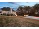 Expansive backyard with a large deck, basketball court, and storage shed perfect for outdoor activities and entertainment at 2778 Macland Rd, Dallas, GA 30157