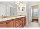 Bathroom featuring double sinks with wooden cabinets, granite countertop, and tiled floors at 2778 Macland Rd, Dallas, GA 30157