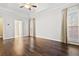 Bedroom featuring hardwood floors, tray ceiling, ceiling fan, and lots of natural light at 2778 Macland Rd, Dallas, GA 30157