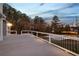 Spacious outdoor deck featuring modern railings and scenic views of the backyard and basketball court at 2778 Macland Rd, Dallas, GA 30157