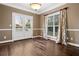 Dining room boasts beautiful hardwood floors, a window with natural light, and double doors leading to the deck at 2778 Macland Rd, Dallas, GA 30157