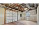 Unfinished garage featuring exposed ceiling and concrete floor at 2778 Macland Rd, Dallas, GA 30157