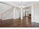 Open-concept living room featuring a fireplace, hardwood floors, and staircase at 2778 Macland Rd, Dallas, GA 30157