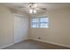 Neutral bedroom featuring plush carpet, ceiling fan with lighting and a double-door closet at 50 Carriage Trce, Stockbridge, GA 30281