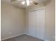 Simple carpeted bedroom featuring double-door closet and neutral paint at 50 Carriage Trce, Stockbridge, GA 30281