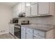 Efficient kitchen featuring stainless steel appliances and granite countertops at 50 Carriage Trce, Stockbridge, GA 30281