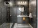 Bathroom with dark gray tile shower and vanity with gold fixtures at 57 Forsyth Nw St # 14D, Atlanta, GA 30303