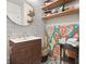 Bathroom vanity with wood accent, floating wood shelves, and artistic decor at 57 Forsyth Nw St # 14D, Atlanta, GA 30303