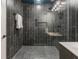 Modern shower with dark grey tiles and a built-in bench and niche at 57 Forsyth Nw St # 14D, Atlanta, GA 30303