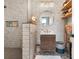 Modern bathroom featuring decorative tiles, a walk-in shower, and open shelving at 57 Forsyth Nw St # 14D, Atlanta, GA 30303