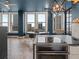 Bright dining area showcasing city views through large windows, featuring a round table with modern chairs at 57 Forsyth Nw St # 14D, Atlanta, GA 30303