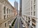 Street view featuring a building facade with detailed design and a well-maintained city street with streetlamps at 57 Forsyth Nw St # 14D, Atlanta, GA 30303