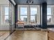 Bright living space featuring large windows, modern furnishings, and herringbone floors at 57 Forsyth Nw St # 14D, Atlanta, GA 30303