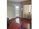 A naturally lit room with a door leading to the balcony at 795 Hammond Dr # 1712, Atlanta, GA 30328