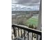 Condo balcony with skyline views of green space, parking, and tennis courts at 795 Hammond Dr # 1712, Atlanta, GA 30328