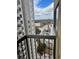 Balcony view of city street and adjacent high-rise apartment building on a sunny day at 795 Hammond Dr # 1712, Atlanta, GA 30328