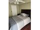 Comfortable bedroom with a stylish headboard, ceiling fan, and natural light at 795 Hammond Dr # 1712, Atlanta, GA 30328