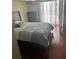 Relaxing bedroom with a comfortable bed, dresser, and a large window at 795 Hammond Dr # 1712, Atlanta, GA 30328