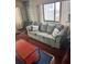 Comfortable living room featuring a plush sofa and large windows for plenty of natural light at 795 Hammond Dr # 1712, Atlanta, GA 30328