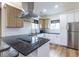 Modern kitchen with stainless steel appliances, granite counters, and a breakfast bar at 1466 Venetian Sw Dr, Atlanta, GA 30311