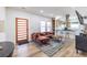 Modern living room featuring an open floor plan, wood flooring, and bright, airy space at 1466 Venetian Sw Dr, Atlanta, GA 30311